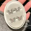 Exquisitos Brillos Finos Temperamento Hueco Mariposa Incrustada con Circonita en Forma de Corazón Clavos para Cartílago Oreja Lujo Ligero Dulce Nicho Generoso Versátil