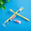 Suministros de hotel cepillo de dientes artículos de tocador desechables pasta de dientes traje empaque independiente aparato dental 2 en 1 venta al por mayor