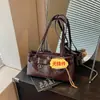 Bolsa Feminina 2026 Verão Nova Casual Versátil Cor Sólida Textura Simples Moda Estilosa para o Trabalho Bolsa de Ombro Único