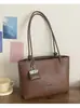 Elegante bolso de mano retro para mujer, nuevo bolso cruzado versátil de moda 2026, bolso de mano para el trabajo, bolso tipo cubo, bolso de axila