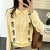 Cárdigan de punto fino para mujer con cuello polo estilo francés y bordado floral, nuevo modelo de otoño 2026, top versátil de manga larga ajustado