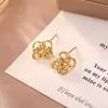Pendientes de Trébol de Cuatro Hojas con Nudo Geométrico Inspirados en el Diseño, Pendientes de Flor Hueca Estilo Minimalista Metálico de Alta Gama, Accesorios de Oreja de Moda
