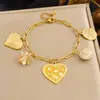Moda Transfronteriza Set de Joyería Corazón con Goteo de Aceite Ojo Maligno Acero Inoxidable Chapado en Oro Versátil Juego de Collar y Pulsera Accesorios para Mujer