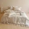 Juego de cuatro piezas de falda de cama de algodón de fibra larga ultrarresistente Clase A, estilo francés suave, juego de ropa de cama con funda nórdica de encaje jacquard 100% algodón