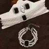 Collar y pulsera de perlas de imitación con flor de diamante francés, cadena de clavícula de nicho de moda, joyería de alta gama que combina con todo.