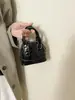 Bolso de mano concha de cuero charol transfronterizo nuevo para mujer, bolso de hombro versátil de alta gama, bolso cruzado versátil de nicho