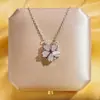 Campanilla de viento de nuevo estilo de solsticio de verano Colgante de flor de lirio Collar con corazón Personalidad retro Concha real Trébol de cuatro hojas Cadena de clavícula exquisita de celebridad de Internet