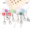 Dispositivo de eje de prueba mérito más una llave llavero luminoso acumulador de llaves colgante tapa de llave electrónica botón juego de descompresión