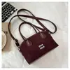 Bolso de mano retro de lujo ligero transfronterizo para mujer, nueva versión coreana, bolso cubo de alta gama para el día a día, bolso versátil de hombro y cruzado