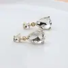 Nuevos Pendientes de Botón de Cristal Ovalados en Forma de Lágrima para Mujer de Moda Lujo Ligero Aguja de Plata S925 Adornos para Orejas Minimalistas Estilo Fresco Pendientes Geométricos
