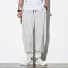 Pantalones Harem Casuales de Lino para Hombre Estilo Chino Otoño 2021 Rayas Retro Combinación de Colores Sueltos Algodón y Lino Botón de Disco