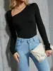 Moda femenina transfronteriza europea y americana nueva Otoño/Invierno 2026: body sexy y elegante de una pieza ajustado con escote asimétrico y color liso