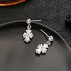 Brincos Cluster de Diamante Cheio de Novo Estilo Transfronteiriços para Homens, Modernos e Versáteis, Brincos de Flor de Íris em Forma de Cruz de Alto Padrão para Mulheres