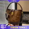 Bolso Cubo Versátil de Alta Gama Estilo Coreano para Mujer, Nuevo Modelo Otoño e Invierno 2026, Bolso de Hombro Cruzado Único, Bolso de Mano Vintage
