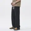 Pantalones casuales de seda helada negra elástica de secado rápido con sensación de frescura para hombre, nuevo modelo de verano 2026, cintura elástica, pantalones de pierna recta holgados