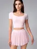 Conjunto Esportivo de Treinamento Pilates Fitness com Saia Curta de Cintura Alta e Camiseta de Manga Curta com Costas em Tela Bonita para Mulheres Versátil