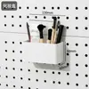 Accesorios para tablero perforado con agujeros redondos, estantería de pared para el hogar, estante de almacenamiento, organizador de escritorio metálico simple, soporte para teléfono, cesta colgante
