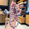 Nova Corrente de Celular com Laço de Strass e Cristal, Pingente Duplo de Contas de Concha, Estilo Ins Levemente Luxuoso High-End Enfeite para Pendurar no Carro Venda por Atacado