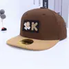 Gorra de Hip-Hop para Niños 2026 Primavera Nueva Gorra de Béisbol con Visera Moda Coreana Cara Sonriente Logo K Gorra de Baile Callejero Transfronterizo