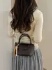 Bolsa de Tecido Nova da Moda para Primavera/Verão 2026 Bolsa de Mão Estilo Balde de Alta Qualidade Versátil Tendência Bolsa de Ombro Transversal