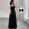 Vestido largo de estilo francés con bloques de color y lazo, de estilo hada, transfronterizo europeo y americano 2026, con corpiño negro puro y diseño de cintura alta