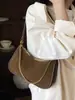 Bolso de hombro de diseño de nicho nuevo, bolso cruzado de alta calidad, bolso de hombro versátil y elegante, bolso de axila moderno para el día a día