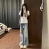 Calça Jeans Azul Claro de Cintura Baixa Micro Flare para Mulheres Verão 2026 Estilo Fino Garota Picante Caimento Solto Alargada na Barra Calça Flare
