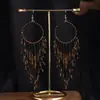 Joyas populares europeas y americanas fuente transfronteriza estilo étnico bohemio retro pendientes largos de borla de cuentas de arroz para mujer