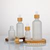 Botella de vidrio engrosado con gotero circular de bambú esmerilado de 5 a 100 ml para aceites esenciales, esencias líquidas, cosméticos, subembotellada.