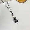 Collar de cordón de cera con oso y lazo de dibujos animados, estilo casual de moda, cadena para suéter de lujo ligero de alta gama para mujer