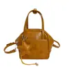 Bolso de Mano Simple Retro Estilo Coreano con Forma de Concha para Mujer 2026 Primavera Nuevo Versátil Lujo Ligero Nicho Bolso de Hombro Cruzado