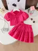 Conjunto de Falda Corta para Niñas de Verano Rosa a Cuadros Cuello de Muñeca Botones Falda Pastel Conjunto de Dos Piezas para Niños