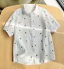 Camisa de Gaze de Algodão de Camada Dupla com Manga Curta, Estilo Novo de Verão 2026 para Mulheres, Design Fresco e Simples com Estampa de Folhas, Camisa Macia de Algodão Puro com Manga Meia-Manga