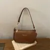 Colección de otoño 2026 de alta calidad, minimalista y elegante: un bolso de hombro chic y versátil con un toque sofisticado, perfecto para ventas transfronterizas