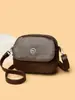 Bolsa de Ombro Fashion Texturizada 2025 Nova Simples Elegante Pequena Redonda Feminina Multicamadas Versátil Bolsa Transversal Tendência Transfronteiriça