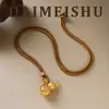 Nuevo collar vintage exquisito y elegante de trébol de cuatro hojas y calabaza giratorio, lujo ligero con un toque de alta gama, collar largo versátil