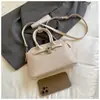 Bolsa pequena tecida com textura cruzada para mulheres 2026 novo estilo bolsa de mão para o trabalho e trajeto bolsa Kelly bolsa transversal estilosa