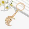 Nuevo llavero con colgante para bolso con forma de corazón redondo, luna, hueco, árbol de la vida, búho, transfronterizo europeo y americano