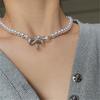 Collar de perlas con lazo y incrustaciones de diamantes para mujer, cadena de clavícula con diseño de nicho, estilo chic, 2024