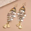 Brincos Gancho Personalizados Criativos Europeus e Americanos em Formato de Peixe com Tassel de Concha Estilo Resort à Beira-Mar Brincos Personalizados de Alta Qualidade para Mulheres