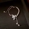 Conjunto de Joias Colar Pulseira com Pingente de Flor de Zircônia e Pérola, Corrente de Clavícula de Luxo Leve e de Alta Qualidade, Moderno e Versátil