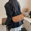 Bolso pequeño de moda para mujer, nueva colección otoño/invierno 2026, bolso de sillín mate de nicho, bolso de hombro/cruzado de alta gama y versátil