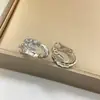 Versión Alta Pendiente Serpiente Oreja Baojia Moda Lujo Ligero Taladros Cabeza y Cola Dos Círculos Taladros Completos Artesanía de Precisión CNC Pendiente Serpiente de Temperamento Zodiaco