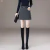 Falda de Línea A de Cintura Alta Otoño 2026 Moda Femenina Versátil Temperamento para Viajes Cortos Falda Corta con Decoración de Cinturón Adelgazante