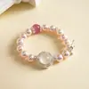 Pulsera geométrica de flor de lazo con cuentas de perla y circón vintage europea y americana, pulsera vintage de alta gama de nicho transfronteriza para mujer