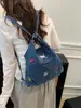 Bolsa de mezclilla multifuncional bordada con cachorro lindo 2026 nueva mochila/bolso de hombro casual de nicho de moda
