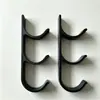 Soporte de pared multi-rollo transfronterizo 2026/3D, organizador de tres niveles de pared para film transparente y papel pergamino para la cocina