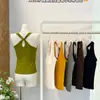 Moda de principios de otoño, nuevo top sin mangas de chica popular con espalda cruzada y almohadilla para el pecho integrada con proteína de seda, tela elástica, tirantes finos 5202