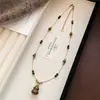 Collar Colgante de Calabaza Ojo de Tigre Chapado en Oro Real de 18k para Mujer Cadena de Suéter de Lujo Ligero Nicho Otoño/Invierno Maillard