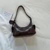 Bolso de axila de moda estilo coreano para mujer, nuevo modelo de verano 2026, bolso simple de media luna, elegante bolso de hombro y cruzado